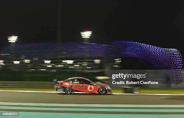 Jamie Whincup drives the Vodafone Holden during race one for round one of the V8 Supercar Championship Series at Yas Marina Circuit on February 19,...