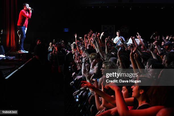 Tom Meighan of Kasabian performs in Paris as they launch the new Umbro England away kit on February 8, 2010 in Paris, France