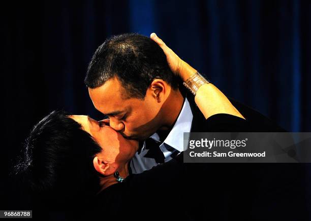 Tiger Woods hugs his mother Kultida following a statement from the Sunset Room on the second floor of the TPC Sawgrass, home of the PGA Tour on...