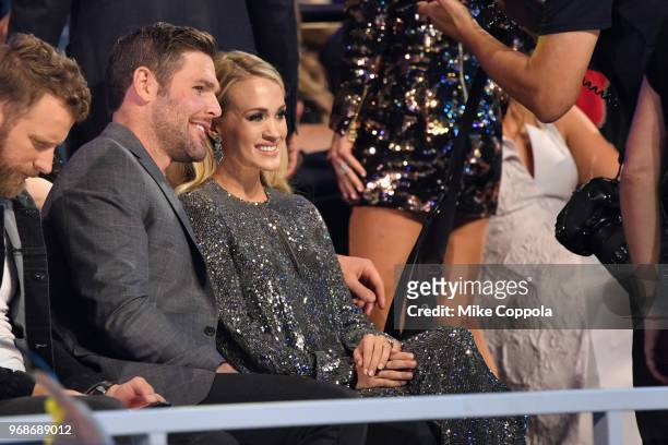 Mike Fisher and Carrie Underwood attend the 2018 CMT Music Awards at Bridgestone Arena on June 6, 2018 in Nashville, Tennessee.