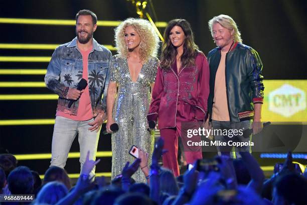 Jimi Westbrook, Kimberly Schlapman, Karen Fairchild and Philip Sweet of Little Big Town speak onstage during the 2018 CMT Music Awards at Bridgestone...