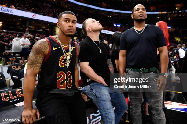 Francisco Lindor, Roberto Perez and Edwin Encarnacion of the Cleveland Indians look on from the sideline during warm ups prior to Game Three of the...