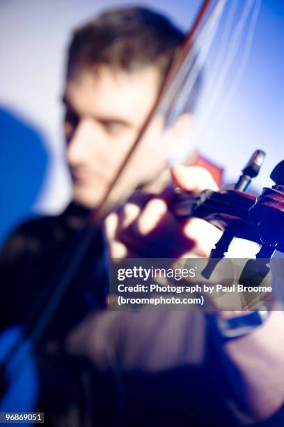 man with violin - tuning peg stock pictures, royalty-free photos & images