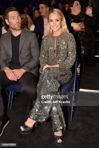 Mike Fisher and Carrie Underwood attend the 2018 CMT Music Awards at Bridgestone Arena on June 6, 2018 in Nashville, Tennessee.