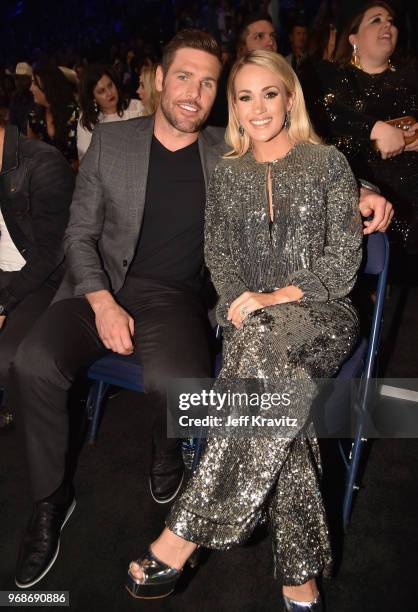 Mike Fisher and Carrie Underwood attend the 2018 CMT Music Awards at Bridgestone Arena on June 6, 2018 in Nashville, Tennessee.