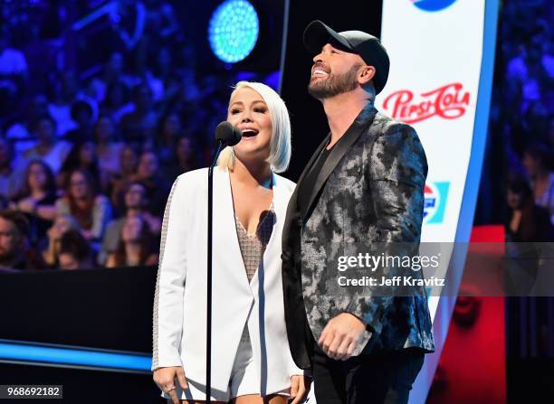 RaeLynn and Cody Alan speak onstage at the 2018 CMT Music Awards at Bridgestone Arena on June 6, 2018 in Nashville, Tennessee.