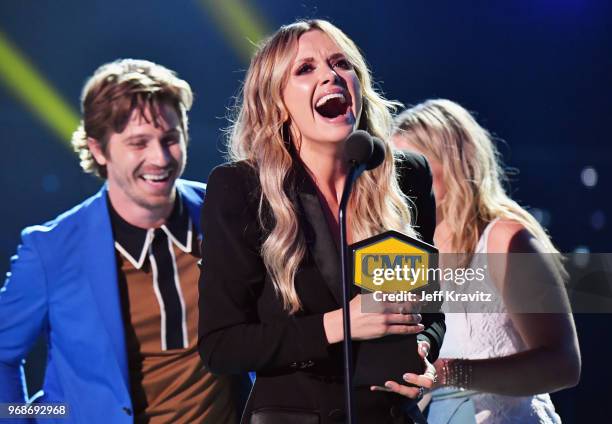 Garrett Hedlund, Carly Pearce and Lauren Alaina speak onstage at the 2018 CMT Music Awards at Bridgestone Arena on June 6, 2018 in Nashville,...