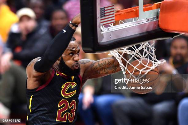 LeBron James of the Cleveland Cavaliers dunks against the Golden State Warriors in the first quarter during Game Three of the 2018 NBA Finals at...