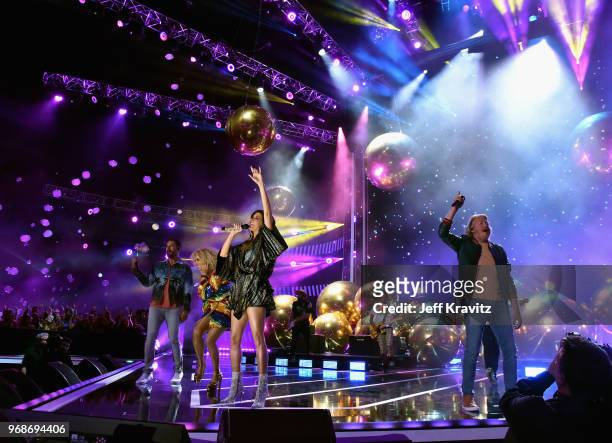 Jimi Westbrook, Kimberly Schlapman, Karen Fairchild and Philip Sweet of band Little Big Town perform onstage at the 2018 CMT Music Awards at...