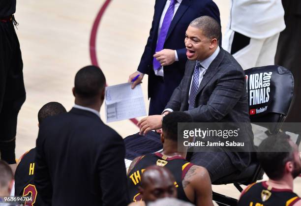 Head coach Tyronn Lue of the Cleveland Cavaliers talks to his team during a timeout against the Golden State Warriors in the first quarter during...
