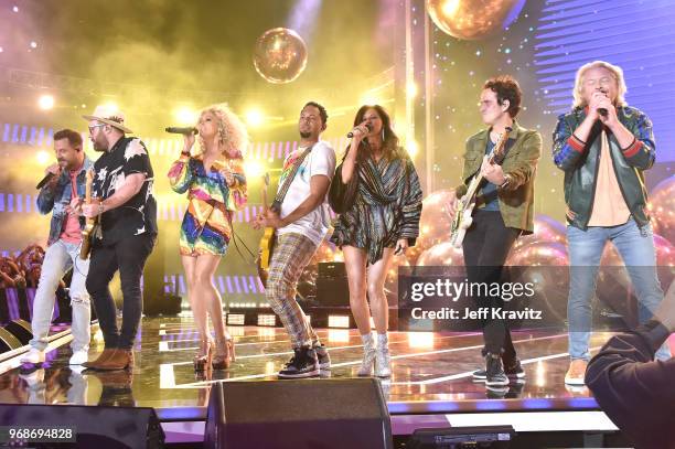 Jimi Westbrook, Kimberly Schlapman, Karen Fairchild and Philip Sweet of band Little Big Town perform onstage at the 2018 CMT Music Awards at...