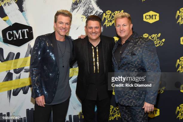 Joe Don Rooney, Jay DeMarcus and Gary LeVox of musical group Rascal Flatts attend the 2018 CMT Music Awards at Bridgestone Arena on June 6, 2018 in...