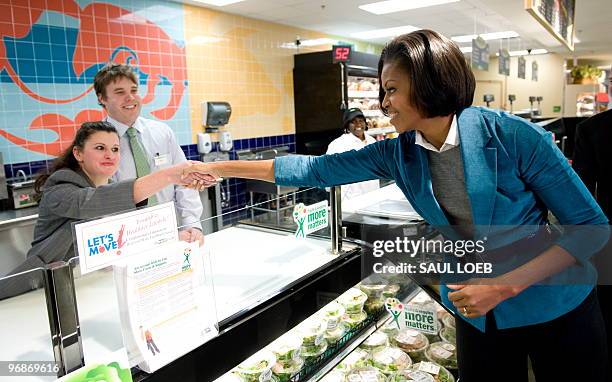 First Lady Michelle Obama greets store employees while touring the Fresh Grocer supermarket in Philadelphia, Pennsylvania, February 19, 2010. Obama,...