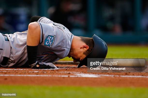 Brian Anderson of the Miami Marlins reacts after fouling a pitch off his foot against the St. Louis Cardinals in the second inning at Busch Stadium...