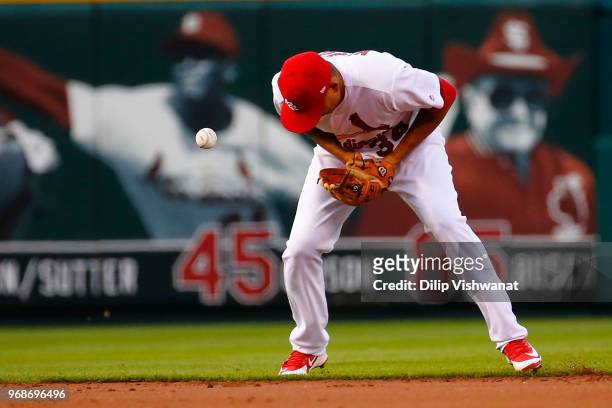Yairo Munoz of the St. Louis Cardinals misplays a groundball against the Miami Marlins in the second inning at Busch Stadium on June 6, 2018 in St....
