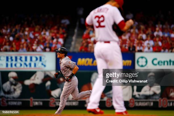 Derek Dietrich of the Miami Marlins rounds the bases after hitting a two-run home runagainst the St. Louis Cardinals in the third inning at Busch...