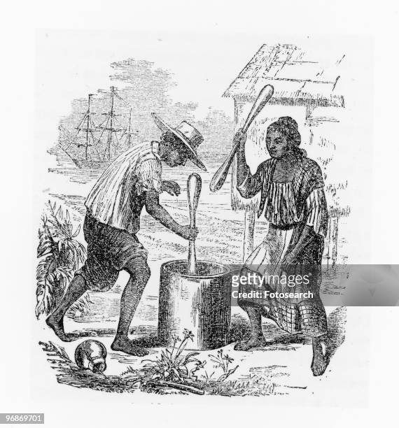 Tagal Indians pounding rice' in an illustration which appeared in the 1853 edition of 'Twenty Years in the Philippines,' by Paul De La Gironiere....