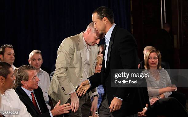 Tiger Woods greets, Notah Begay III, PGA Commissioner Tim Finchem, and Rob McNamara at the Sunset Room on the second floor of the TPC Sawgrass, home...