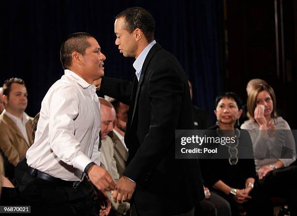 Tiger Woods greets Notah Begay III at the Sunset Room on the second floor of the TPC Sawgrass, home of the PGA Tour on February 19, 2010 in Ponte...