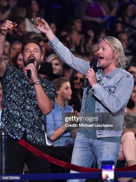 Jimi Westbrook and Philip Sweet of musical group Little Big Town speak at the 2018 CMT Music Awards at Bridgestone Arena on June 6, 2018 in...