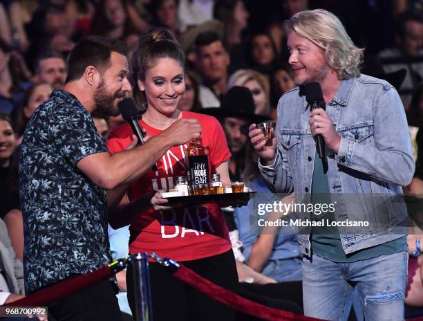 Jimi Westbrook and Philip Sweet of musical group Little Big Town speak at the 2018 CMT Music Awards at Bridgestone Arena on June 6, 2018 in...