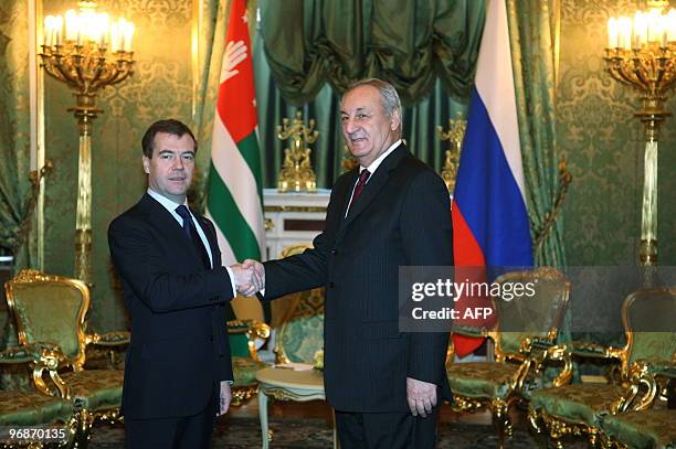 Russian President Dmitry Medvedev shakes hands with President of Georgia's breakaway Abkhazia region Sergei Bagapsh at the Kremlin in Moscow on...