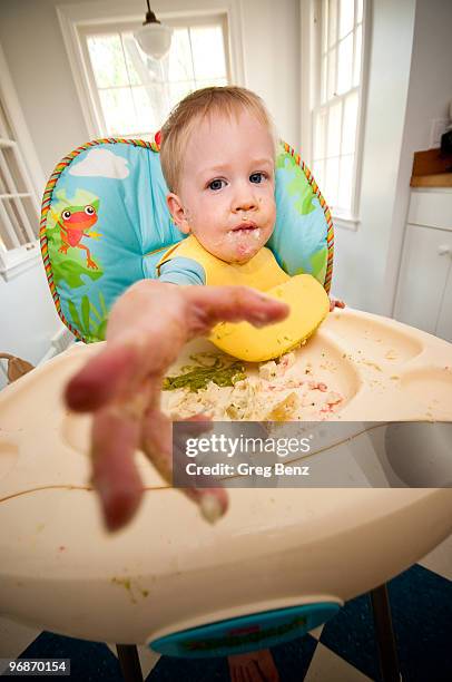 baby boy  with food on face - baby face stock pictures, royalty-free photos & images