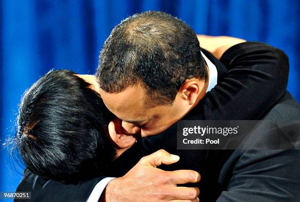 Tiger Woods hugs his mother Kultida Woods after making a statement from the Sunset Room on the second floor of the TPC Sawgrass, home of the PGA Tour...