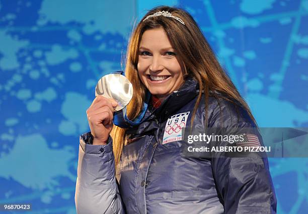Silver medallist Julia Mancuso stands on the podium during the medal ceremony for the Alpine skiing Ladies Super combined event of the Vancouver 2010...