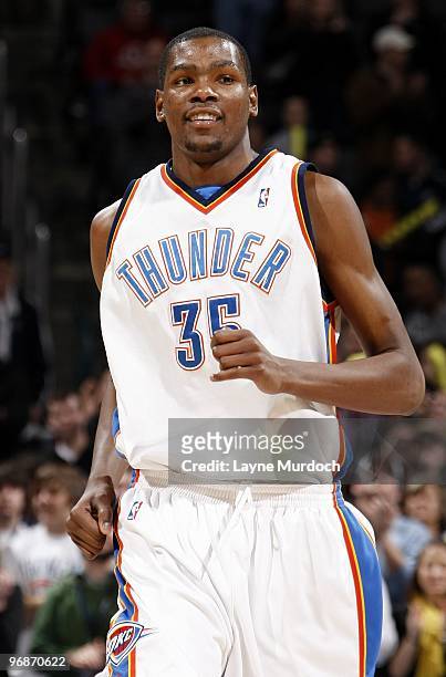 Kevin Durant of the Oklahoma City Thunder runs up court with a smile during the game against the Golden State Warriors at Ford Center on January 31,...