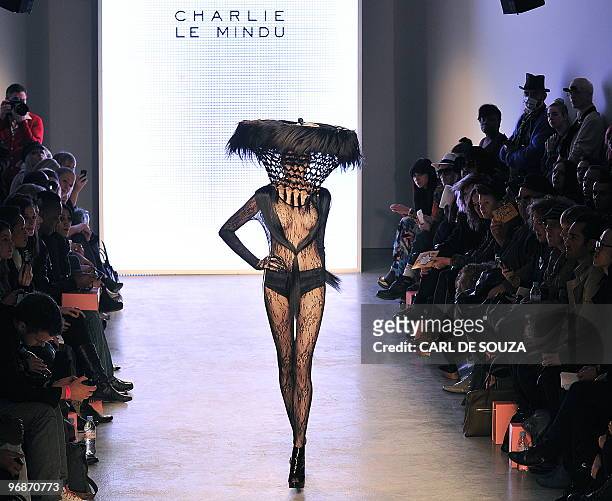 Model presents a creation by Charlie Le Mindu during the first day of London Fashion Week, in London, on February 19, 2010. AFP PHOTO/ CARL DE SOUZA