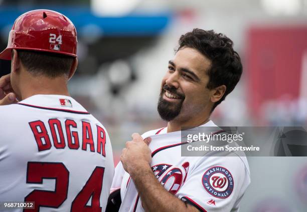 Washington Nationals third baseman Anthony Rendon on first base with first base coach Tim Bogar during a MLB game between the Washington Nationals...