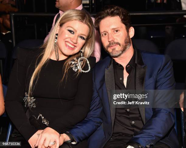 Kelly Clarkson and Brandon Blackstock attend the 2018 CMT Music Awards at Bridgestone Arena on June 6, 2018 in Nashville, Tennessee.