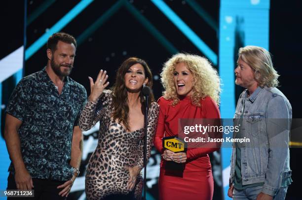 Jimi Westbrook, Karen Fairchild, Kimberly Schlapman and Philip Sweet of Little Big Town accept an award onstage at 2018 CMT Music Awards at...