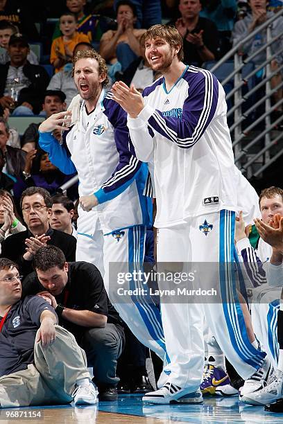 Sean Marks and Aaron Gray of the New Orleans Hornets celebrate from the bench during the game against the Philadelphia 76ers on February 5, 2010 at...