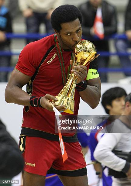 Bahrain's captain Said Jawhar poses with the second place trophy at the end of the Asian handball championship in Beirut on February 19, 2010. South...