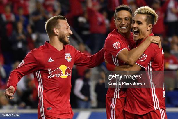 Aaron Long of New York Red Bulls celebrates a goal with Daniel Royer and Sean Davis against the New York City FC in the second half during the fourth...