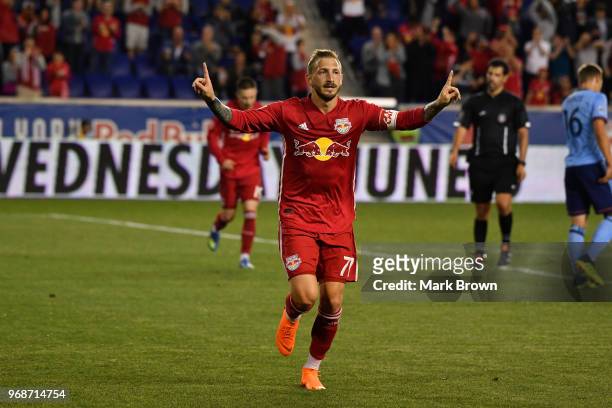 Daniel Royer of New York Red Bulls celebrates on the field after scoring a goal against the New York City FC in the second half during the fourth...