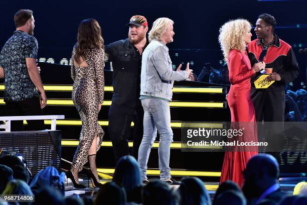 Jimi Westbrook, Karen Fairchild, Kimberly Schlapman and Philip Sweet of Little Big Town accept an award onstage at the 2018 CMT Music Awards at...