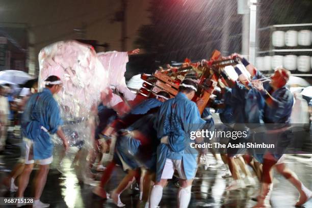 Shrine parishioners swing 'Bonten' floats during the 'Bonten Togyo' a part of the Agata Festival in front of Agata Jinja Shrine on June 6, 2018 in...