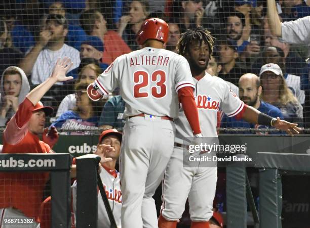 Aaron Altherr of the Philadelphia Phillies is greeted by Odubel Herrera after hitting a three-run homer against the Chicago Cubs during the sixth...