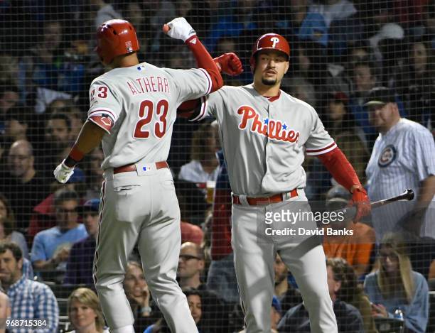 Aaron Altherr of the Philadelphia Phillies is greeted by Dylan Cozens after hitting a three-run homer against the Chicago Cubs during the sixth...