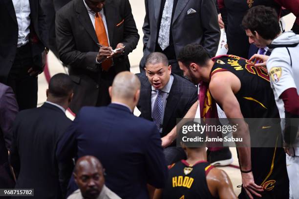 Head coach Tyronn Lue of the Cleveland Cavaliers talks to his team during a timeout against the Golden State Warriors in the first quarter during...