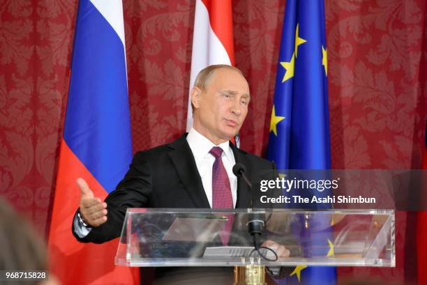 Russian President Vladimir Putin speaks during a joint press conference following his meeting with Austrian President Alexander van der Bellen at...