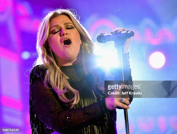 Kelly Clarkson performs onstage at the 2018 CMT Music Awards at Bridgestone Arena on June 6, 2018 in Nashville, Tennessee.