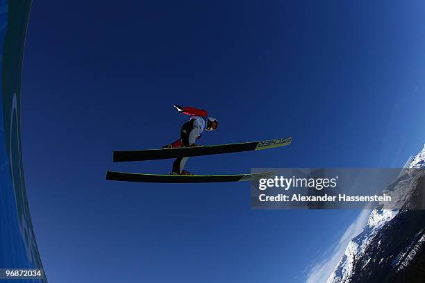 Taku Takeuchi of Japan soars off the Long Hill during the qualification round on day 8 of the 2010 Vancouver Winter Olympics at Ski Jumping Stadium...