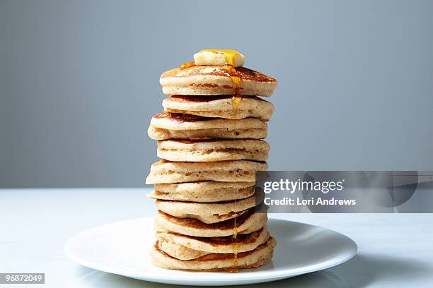 stack of pancakes with butter and maple syrup - lori andrews stock pictures, royalty-free photos & images