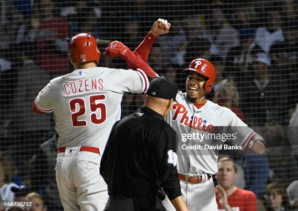 Dylan Cozens of the Philadelphia Phillies is greeted by Aaron Altherr after hitting a two-run home run against the Chicago Cubs during the ninth...