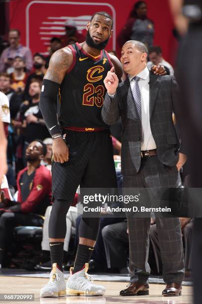 LeBron James and Head Coach Tyronn Lue of the Cleveland Cavaliers talk during the game against the Golden State Warriors during Game Three of the...