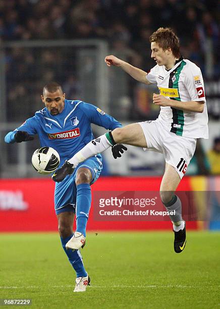 Marvin Compper of Hoffenheim and Marco Reus of Gladbach battle for the ball during the Bundesliga match between 1899 Hoffenheim and Borussia...